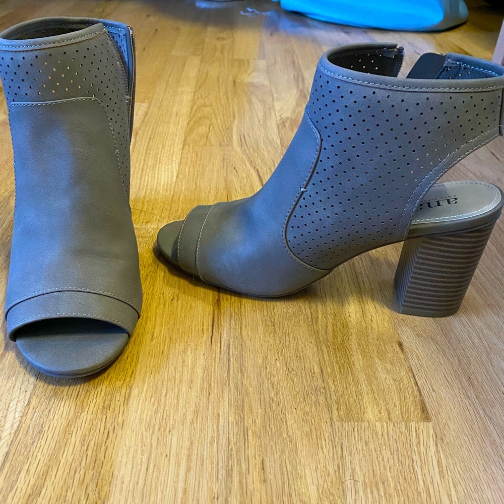 Brand new. Opened toe booties w/ heel.